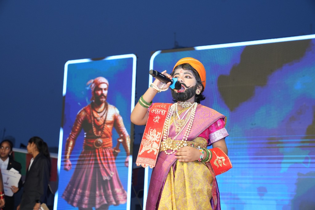 Student performing in cultural outfit