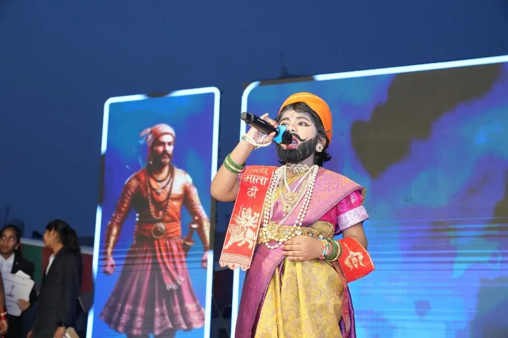 Student performing in cultural outfit