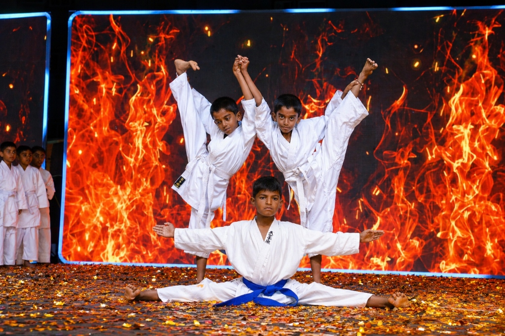 Students performing Karate on stage