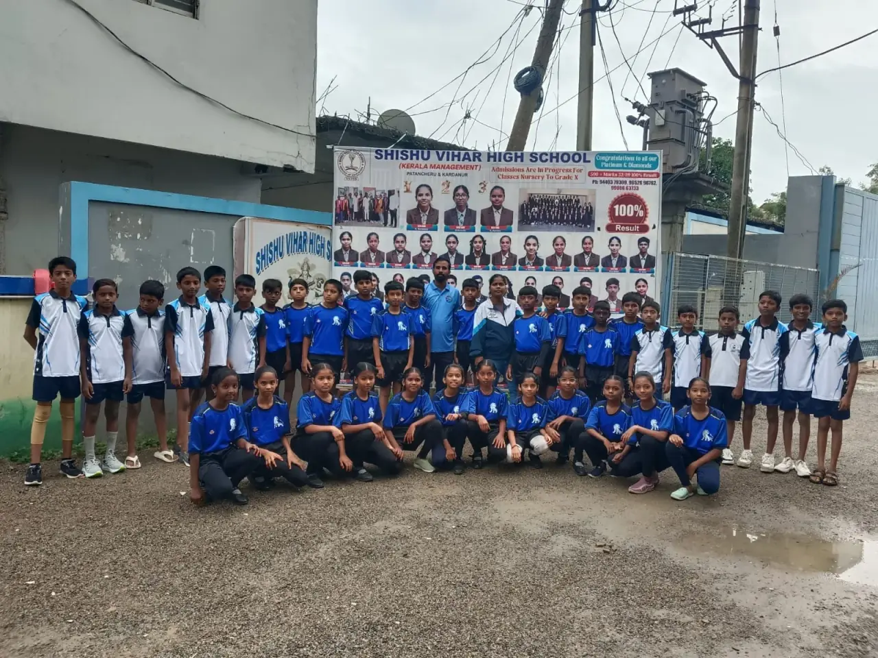 Students in team jerseys with their coaches